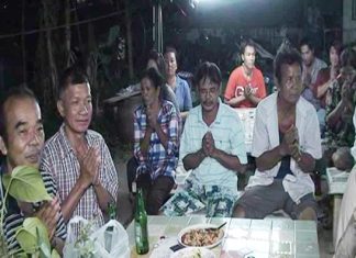 Family and friends gather around to say their final goodbyes to Jao Saen, their beloved water buffalo.